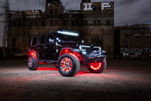 Load image into Gallery viewer, Jeep with Oracle Bluetooth + RF Underbody Rock Light Kit lit up at night for high performance car parts enthusiasts.