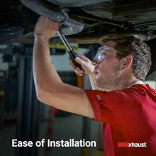 Load image into Gallery viewer, Mechanic installing MagnaFlow BRE Exhaust Kit