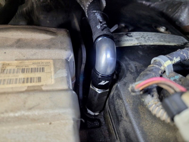 Mishimoto 2007.5+ Ram 6.7L Cummins Top Heater Hose Upgrade in engine compartment, enhancing performance and reliability in cooling system.