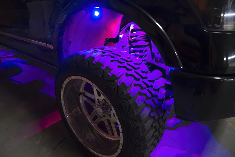Oracle Bluetooth + RF Underbody Rock Light Kit - 8 PCS - ColorSHIFT installed on off-road vehicle with purple LED glow, DTX Performance