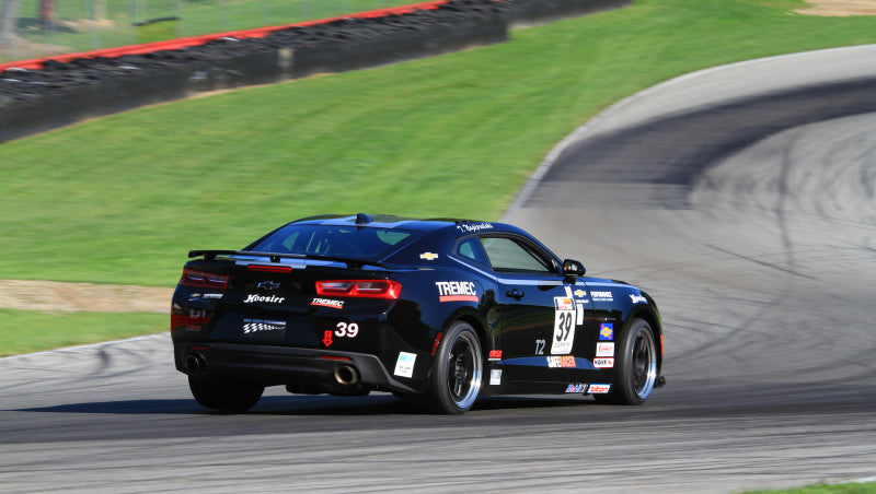 Corsa 2016-2024 Chevrolet Camaro SS 6.2L V8 on track, showcasing performance car parts and DTX Performance upgrades in action.
