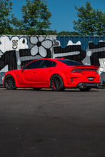 Load image into Gallery viewer, MBRP 17-21 Charger 5.7L 3in Dual Rear Exit Aluminized Catback Exhaust on red car by graffiti wall - DTX Performance