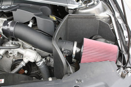 JLT 11-14 Ford Mustang V6 Black Textured Cold Air Intake Kit w/Red Filter shown in engine bay for performance upgrade