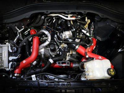aFe 22-23 Ford Explorer BladeRunner Aluminum Hot and Cold Charge Pipe Kit - Red, installed for enhanced engine performance.
