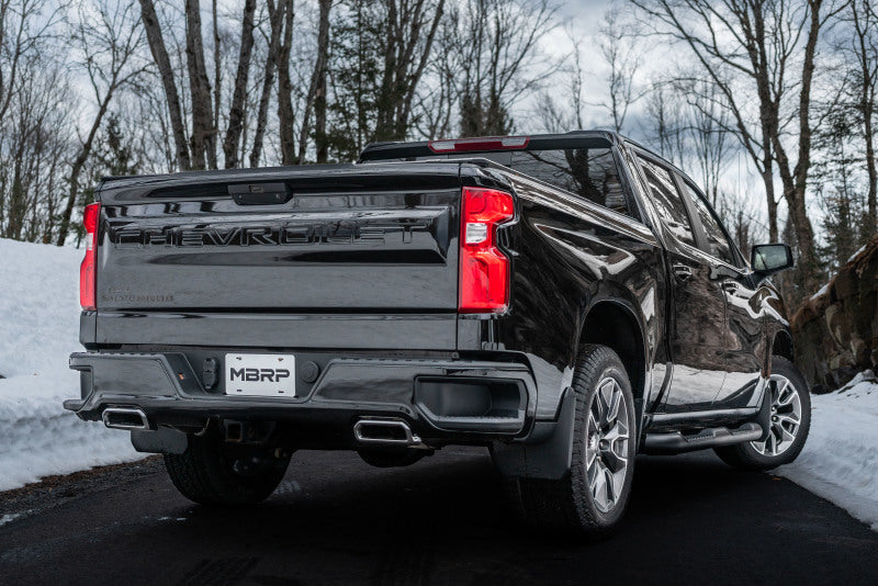MBRP 19-Up Chevrolet/GMC 1500 6.2L T409 Stainless Steel 3in Muffler Bypass on truck in snowy setting
