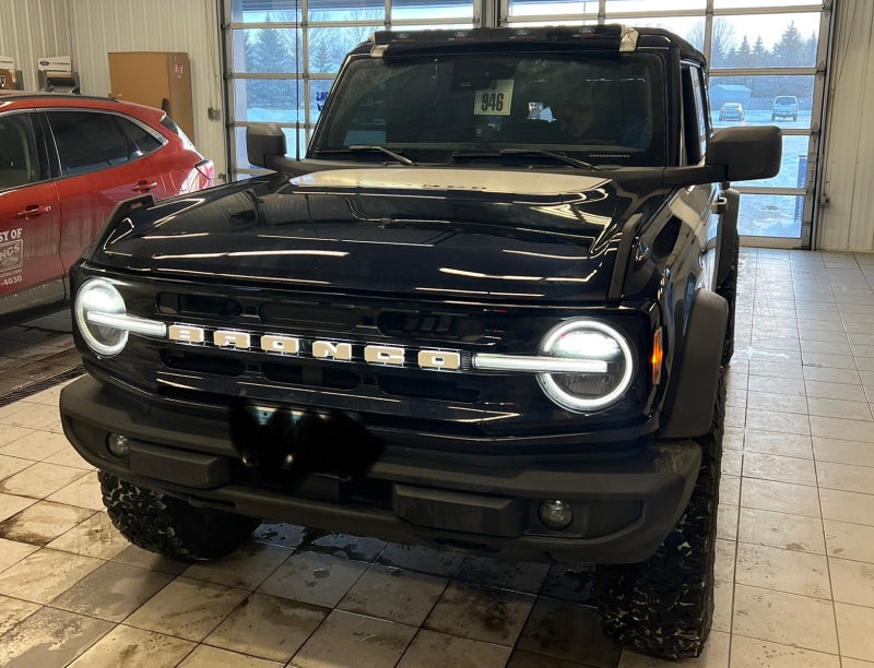 ORACLE Lighting Universal Illuminated LED Letter Badges - Matte Wht Surface Finish - O installed on a customized performance vehicle in a garage.