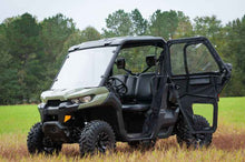 Load image into Gallery viewer, Seizmik 16-24 Can Am Defender HD5-HD10 Front Soft Door Kit on a field-ready UTV