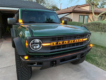 Load image into Gallery viewer, Green SUV with ORACLE Lighting Universal Illuminated LED Letter Badges - Matte Blk Surface Finish - O for performance upgrades