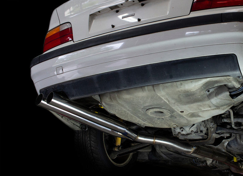 ISR Performance Series II - EP Dual Rear Section Only - BMW E36 exhaust displayed on a car, showcasing performance upgrades.