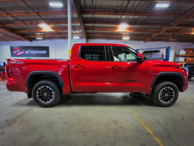 aFe CONTROL 1.875 IN Leveling Kit 22-23 Toyota Tundra - Red in workshop