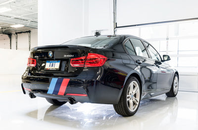 AWE Tuning BMW F3X 340i Touring Edition Axle-Back Exhaust with Diamond Black Tips on performance car in garage