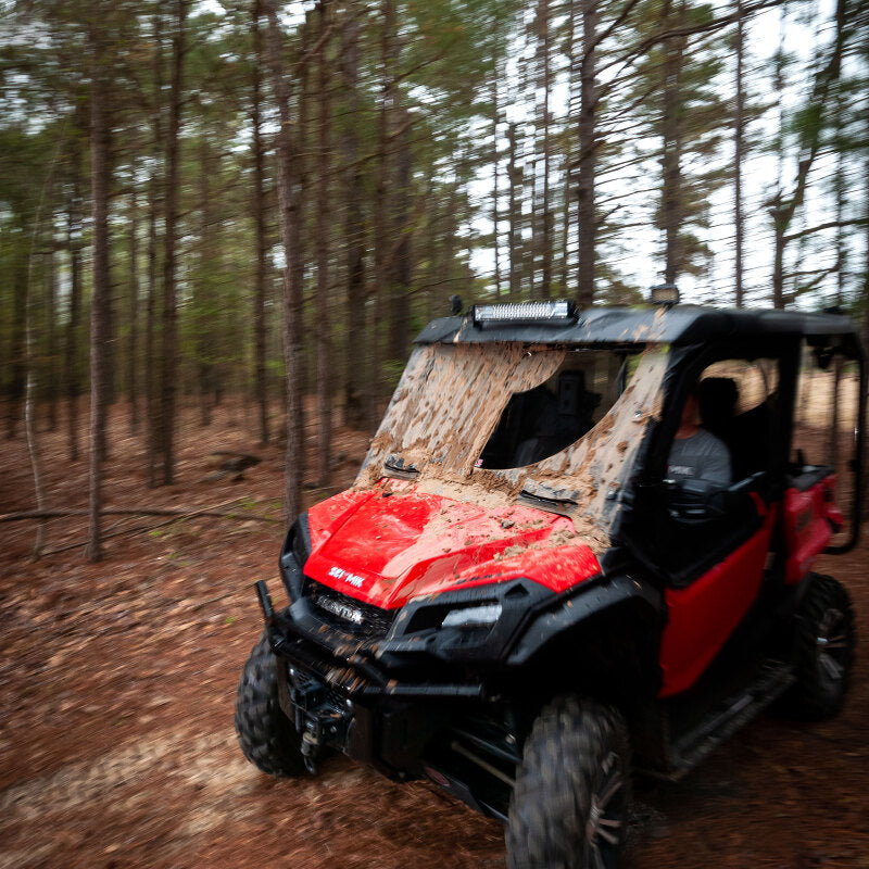 Seizmik Universal UTV Wiper Assembly in action on a muddy trail, ideal for performance car parts and tuning upgrades, available at DTX Performance.