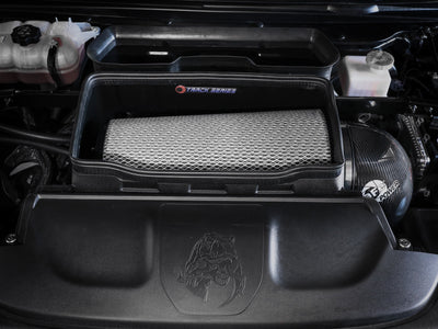Engine bay with aFe 21-23 RAM 1500 TRX Track Series Carbon Fiber Cold Air Intake System w/ Pro DRY S for performance upgrades